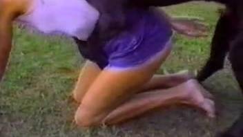Sexy ladies relishing outdoor bestiality in a retro clip